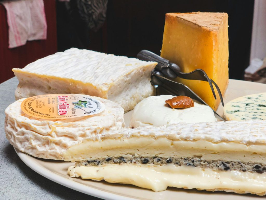 a white plate topped with different types of cheese